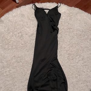 Floor length satin elegant black dress with beaded swoop back.